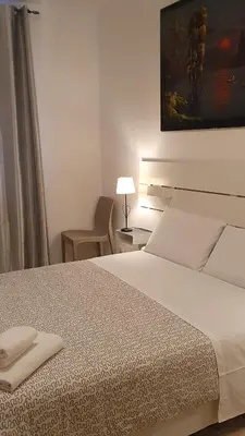 Letto o letti in una camera di Casa del Pozzo