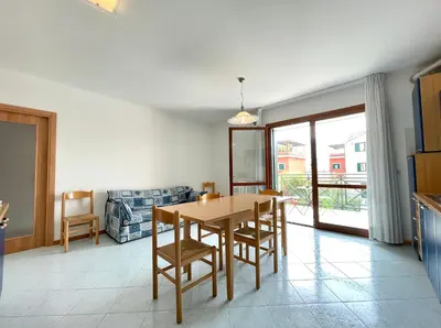 Area soggiorno di Residence Ca D'Oro con piscina Cavallino - Carraro Immobilare - Family Apartments