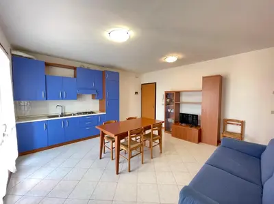 Cucina o angolo cottura di Residence Ca D'Oro con piscina Cavallino - Carraro Immobilare - Family Apartments