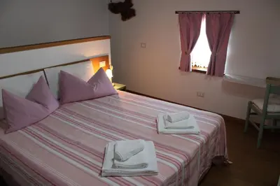 Letto o letti in una camera di Giuliva B&B