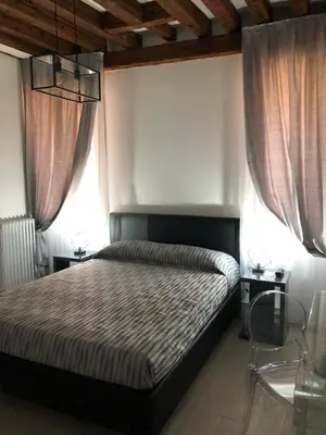 Letto o letti in una camera di Marin Traghetto - Locazione Turistica