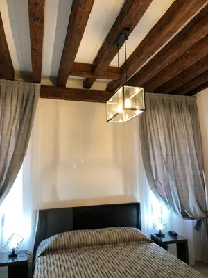 Letto o letti in una camera di Marin Traghetto - Locazione Turistica