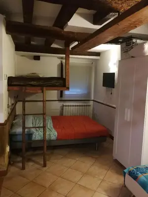 Letto o letti in una camera di El Bagolo - VENEZIA