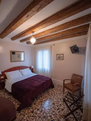 Letto o letti in una camera di B&B a le Boteghe