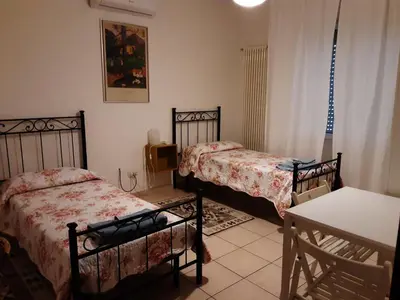 Letto o letti in una camera di Locazione Menini - Camere zona stazione