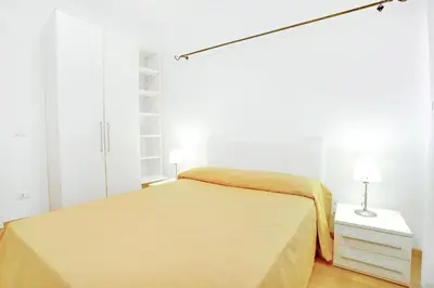 Letto o letti in una camera di Bricola Biennale Apartments
