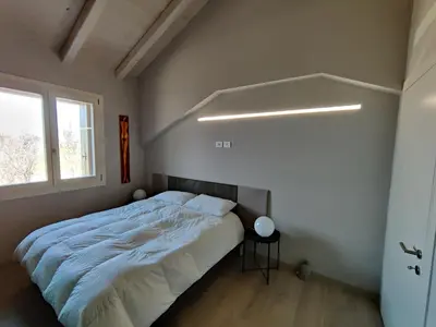 Letto o letti in una camera di BERTESINA325 Superior Apartment