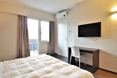 TV o dispositivi per l'intrattenimento presso Venice Terminal Apartments & Suites
