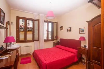 Letto o letti in una camera di Hotel dalla Mora