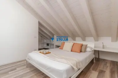 Letto o letti in una camera di Condominio Aquileia