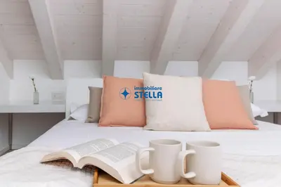 Letto o letti in una camera di Condominio Aquileia