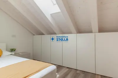 Letto o letti in una camera di Condominio Aquileia