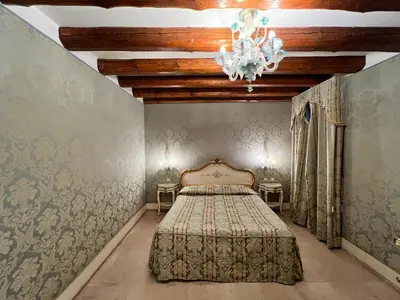 Letto o letti in una camera di Hotel Ca' Dogaressa