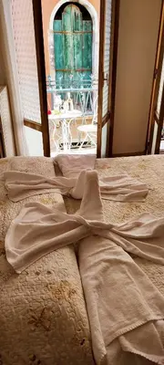 Letto o letti in una camera di My Rialto Palace