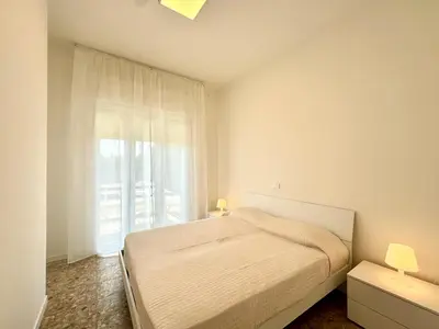 Letto o letti in una camera di Villa Fronte Mare - Carraro Immobiliare - Family Apartments