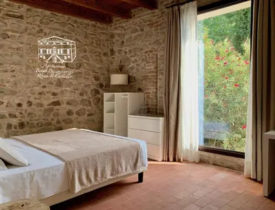 Letto o letti in una camera di Agriturismo Borgo Buzzaccarini Rocca di Castello