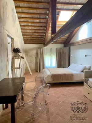Letto o letti in una camera di Agriturismo Borgo Buzzaccarini Rocca di Castello