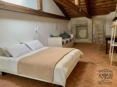 Letto o letti in una camera di Agriturismo Borgo Buzzaccarini Rocca di Castello