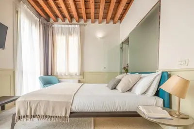 Letto o letti in una camera di Lion Palace - San Marco R&R