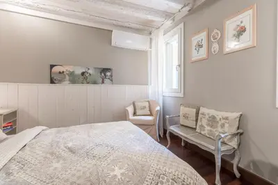 Letto o letti in una camera di Ca Falier Piccolo - little sweet studio in 10-12 minutes from bus&train station
