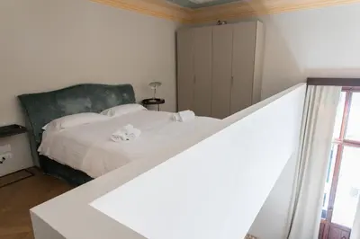 Letto o letti in una camera di Infinite House Ca' Vendramin