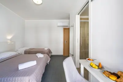 Letto o letti in una camera di Hotel La Siesta
