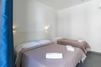 Letto o letti in una camera di Hotel La Siesta