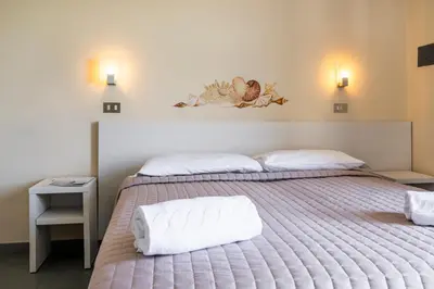 Letto o letti in una camera di Hotel La Siesta