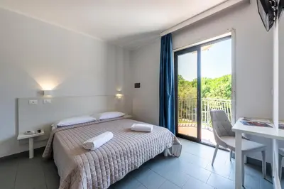 Letto o letti in una camera di Hotel La Siesta