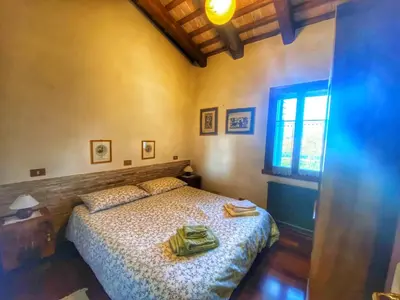 Letto o letti in una camera di Villa Stefania Asolo piscina e biliardo