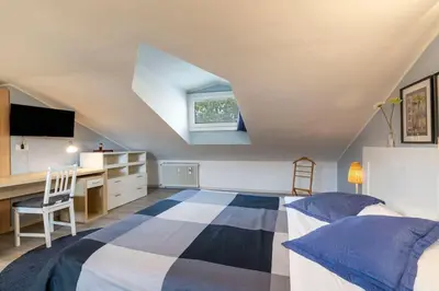 Letto o letti in una camera di enJoy Home - Monolocale S Sofia sui tetti di Padova