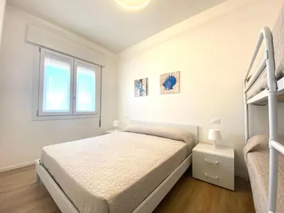 Letto o letti in una camera di Maria Luisa - Piazza Mazzini - 30 MT dal mare - Jesolo