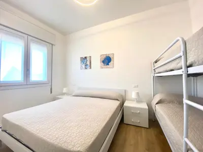 Letto o letti in una camera di Maria Luisa - Piazza Mazzini - 30 MT dal mare - Jesolo