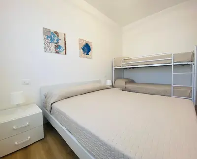 Letto o letti in una camera di Maria Luisa - Piazza Mazzini - 30 MT dal mare - Jesolo