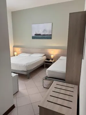 Letto o letti in una camera di Hotel Ammare
