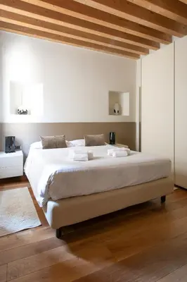 Letto o letti in una camera di Calle Teatro Vecchio - Venezia