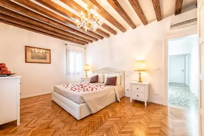 Letto o letti in una camera di Casanova Fenice - Canal View