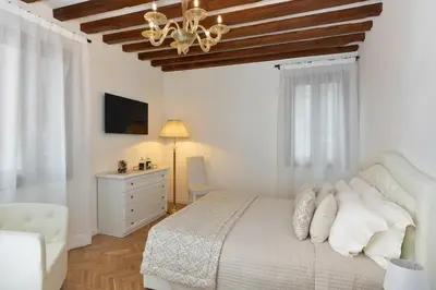 Letto o letti in una camera di Casanova Fenice - Canal View