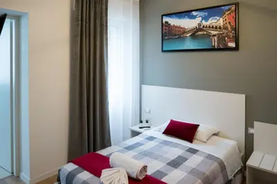 Letto o letti in una camera di Venice Rooms