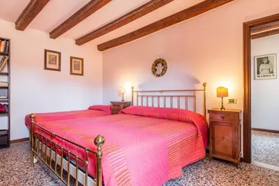 Letto o letti in una camera di Venezianamente Apartments - Venice City Centre