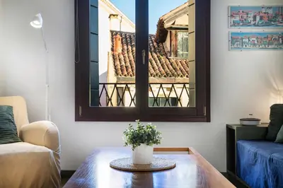 Area soggiorno di MANSARDINA - 1 min from Accademia - duplex stylish and cosy