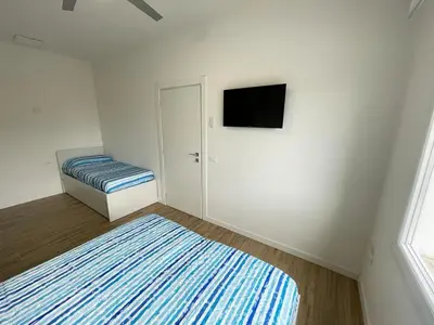 Letto o letti in una camera di CONDOMINIO ROSA- WALTERIGATO APARTMENTS-SOLO PER FAMIGLIE