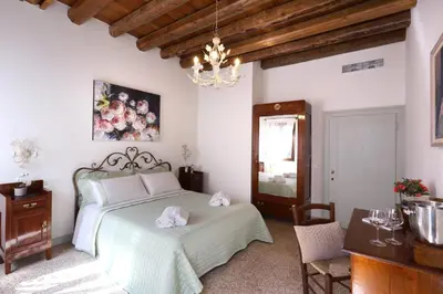Letto o letti in una camera di Ca' del Pittor Apartments