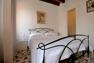 Letto o letti in una camera di Casa dea corte apartment