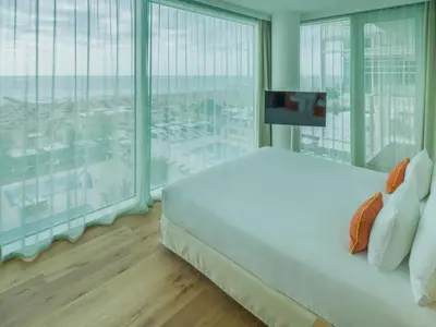 Letto o letti in una camera di Falkensteiner Residences Jesolo