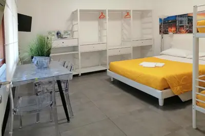 Letto o letti in una camera di GreenColors DEPENDANCE