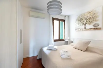 Letto o letti in una camera di Palazzina San Polo 2151
