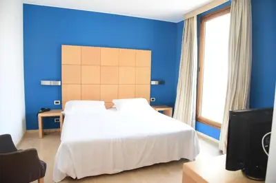 Letto o letti in una camera di HOTEL DUCA D'AOSTA
