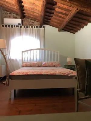 Letto o letti in una camera di B&B BAGOLARI