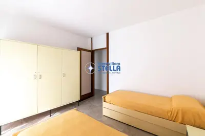 Letto o letti in una camera di Condomino Marina Marconi